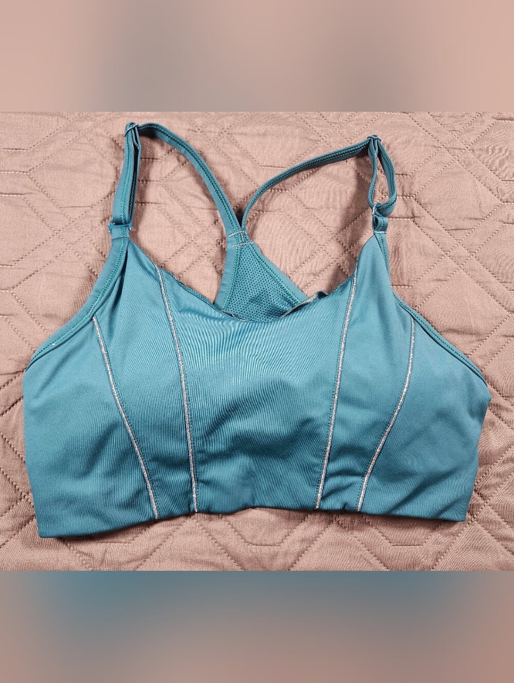 teal Nike Dri-FIT Indy light-support sports bra sparkling metallic tape accents